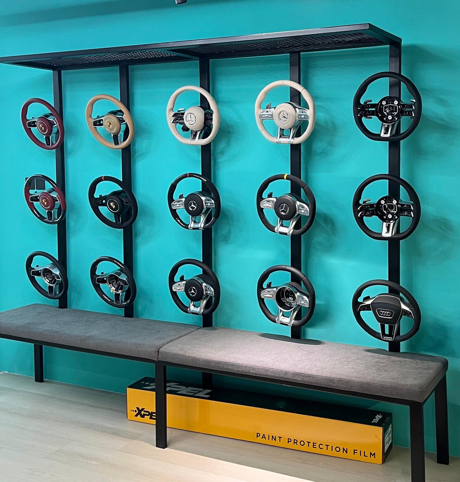 Cartamin steering wheel display wall inside showroom in Dubai