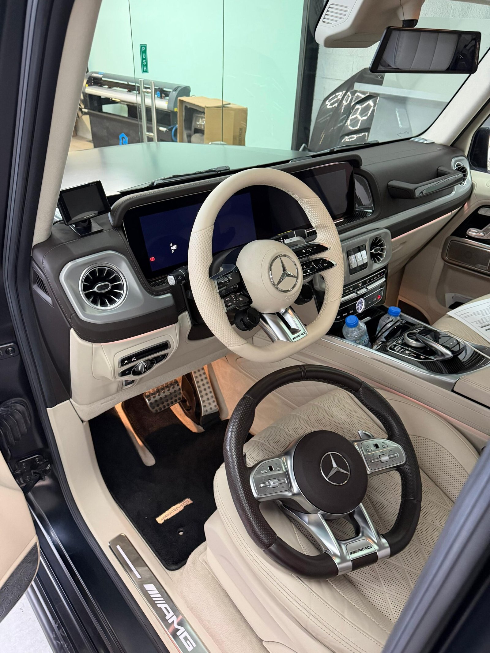 After Mercedes-Benz interior with cream AMG performance button steering wheel