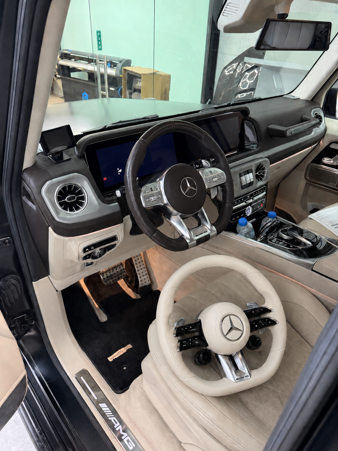 Before Mercedes-Benz interior with cream AMG performance button steering wheel